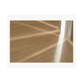 Print of a photograph of morning light falling in bands across a pale wood floor.