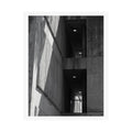 Print of a black and white photograph looking up a concrete stairwell.